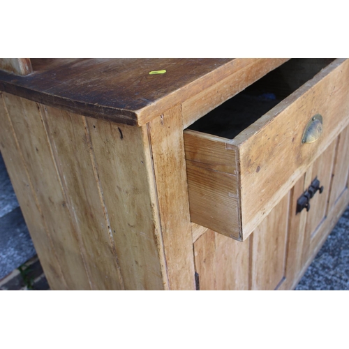 626 - A 19th century waxed pine dresser, fitted three shelves over two drawers and two cupboards, on block... 