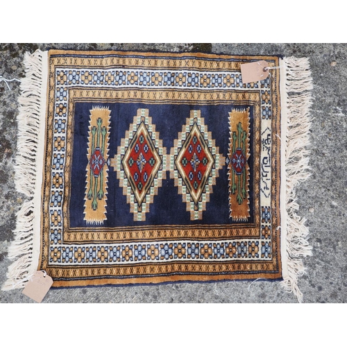 655 - A Bokhara mat of traditional design, 28