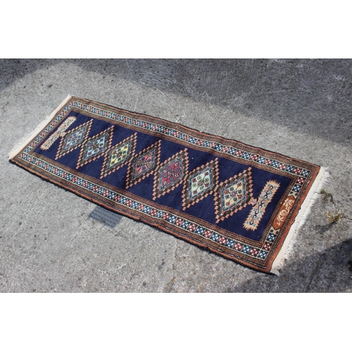 655 - A Bokhara mat of traditional design, 28