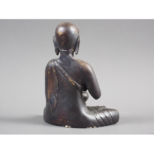 77 - A patinated bronze figure of Buddha, 5