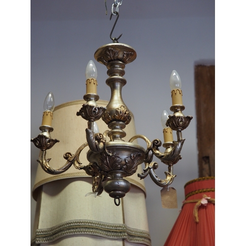 228 - A green and gilt painted five-light ceiling light with scrolled arms, 20 1/2