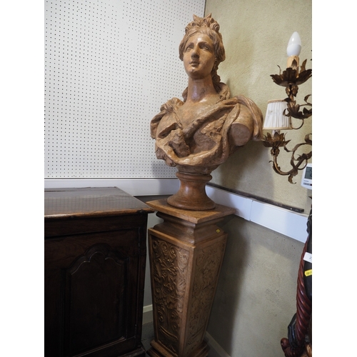 214 - An early 20th century Italian terracotta bust of Diana, on relief decorated pedestal, 74