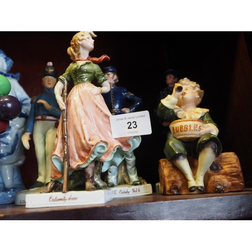 23 - A Royal Doulton figure, “Thanksgiving” 8” high, “The Balloon Seller”, ... 