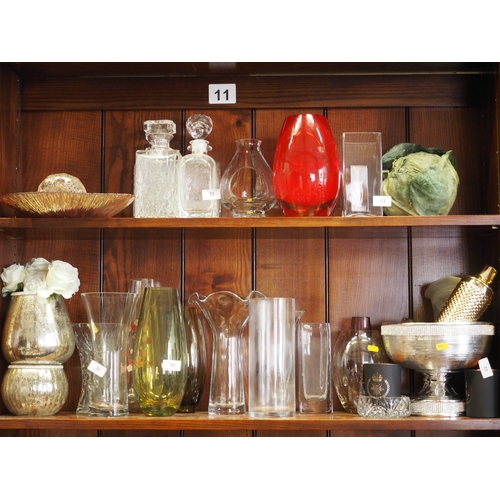 33 - Four decanters, a glass lantern, a collection of glass vases and other decorative items