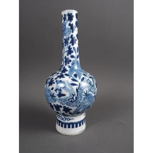 47 - A Chinese blue and white bulbous bottle neck vase with dragon, flower and tree decoration, and six-c... 