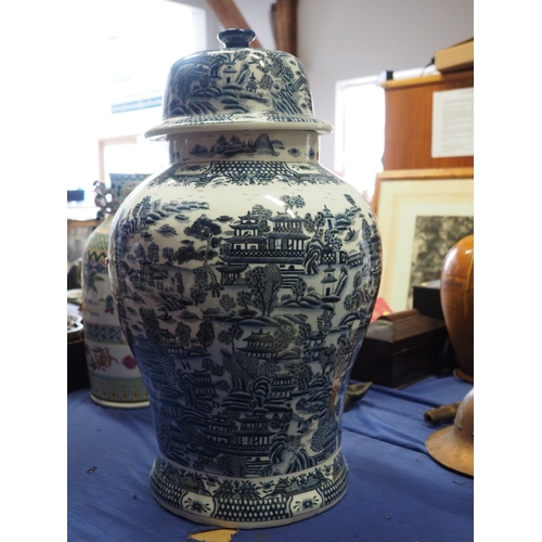 67 - A Chinese blue and white jar and cover with landscape decoration, 30