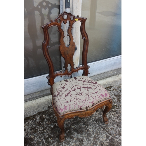 435 - A 19th century carved walnut nursing chair with shaped splat and drop-in seat, upholstered in floral... 