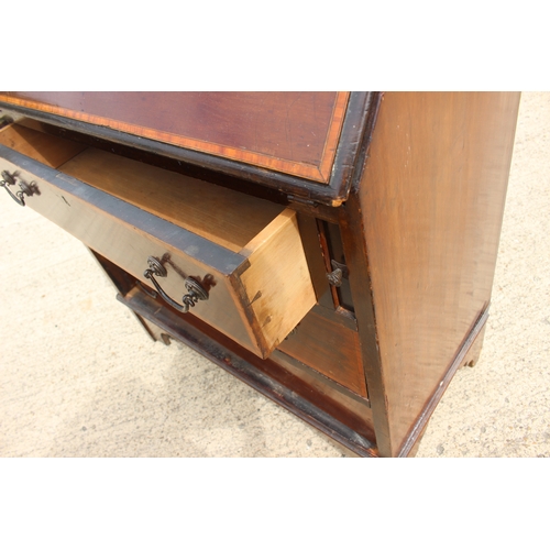 529 - An Edwardian walnut and inlaid fall front bureau with fitted interior over three long drawers, 30