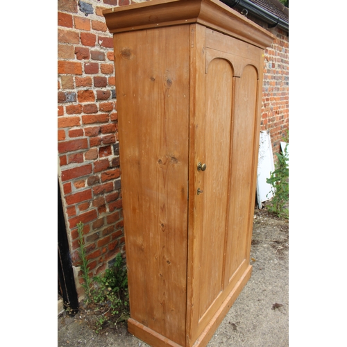 619 - A pine armoire enclosed single door, on block base, 40