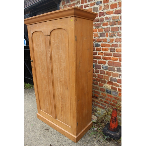 619 - A pine armoire enclosed single door, on block base, 40