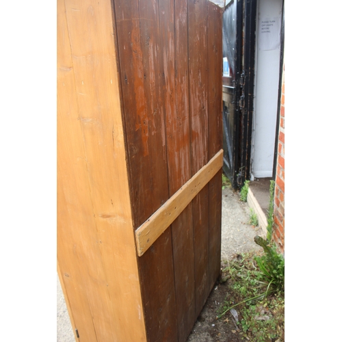 619 - A pine armoire enclosed single door, on block base, 40