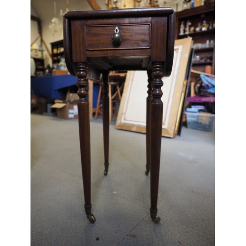 431 - A 19th century mahogany drop flap sewing table, fitted single drawer, on turned and castored support... 