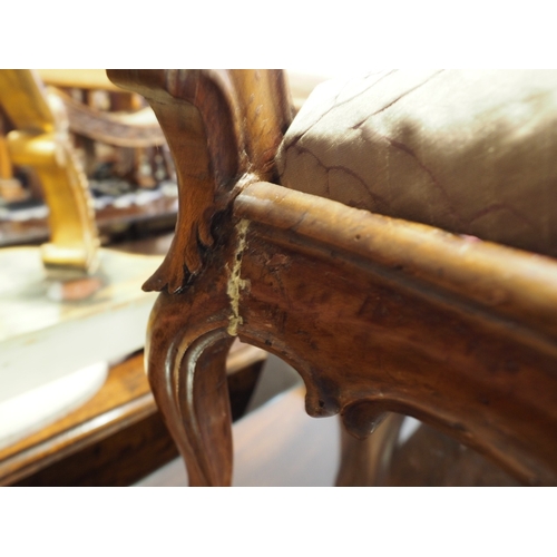 435 - A 19th century carved walnut nursing chair with shaped splat and drop-in seat, upholstered in floral... 