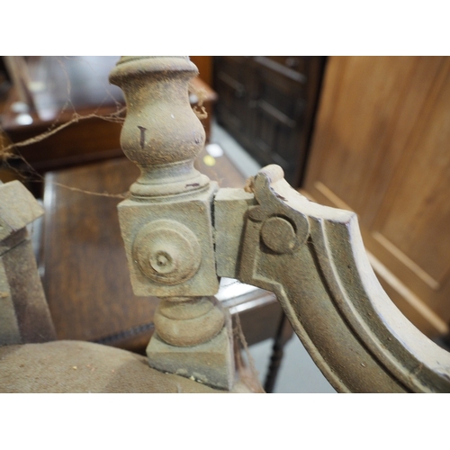 438 - A Victorian carved walnut low seat occasional chair with oval panel back, on turned and castored sup... 