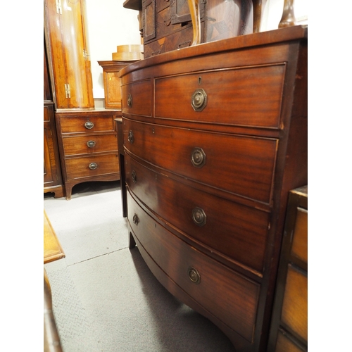 444 - A 19th century mahogany bowfront chest of two short and three long graduated drawers with brass ring... 