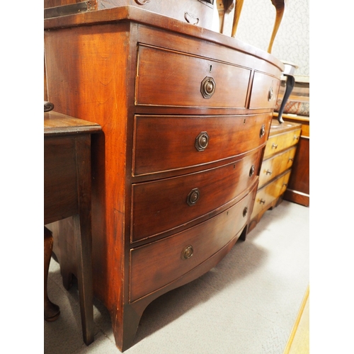 444 - A 19th century mahogany bowfront chest of two short and three long graduated drawers with brass ring... 