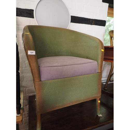 520 - A gilt Lloyd Loom armchair and another similar green armchair