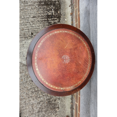 548 - A mahogany drum top occasional table, on tripod support, 20