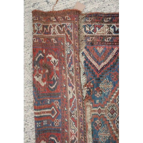 634 - A Hamadan rug with two medallions on a blue floral ground 57