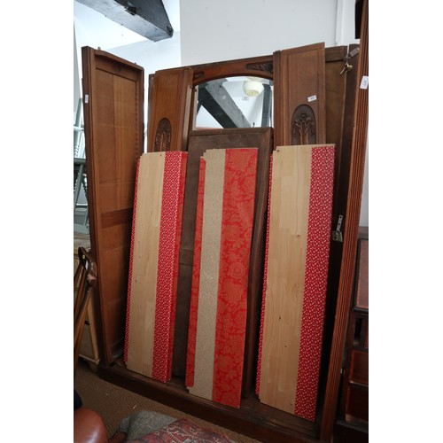 577 - A Belgian carved oak wardrobe enclosed mirror doors 50