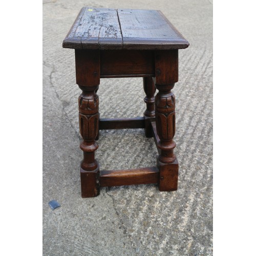 587 - An oak joint stool of 16th century design with carved turned supports united by stretcher rails, 17