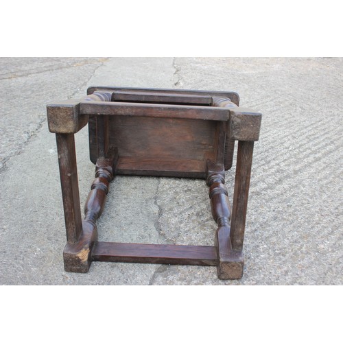 473 - An oak joint stool of 16th century design, on turned splay supports united by stretched rails, 17