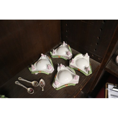 9 - A set of four Continental porcelain table salts with swag and painted plaque decoration on three tap... 