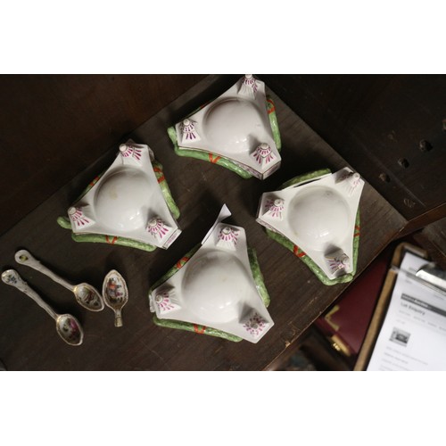 9 - A set of four Continental porcelain table salts with swag and painted plaque decoration on three tap... 