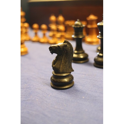 111 - A boxwood and ebonised Staunton style chess set, a Napoleon and Wellington chess set, a 