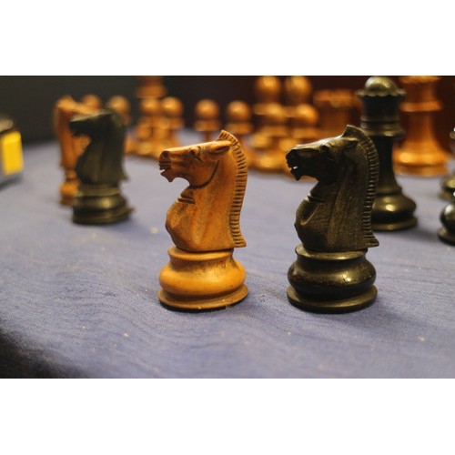 111 - A boxwood and ebonised Staunton style chess set, a Napoleon and Wellington chess set, a 