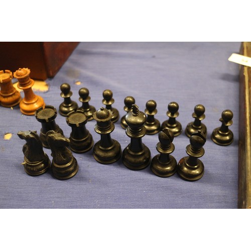 111 - A boxwood and ebonised Staunton style chess set, a Napoleon and Wellington chess set, a 