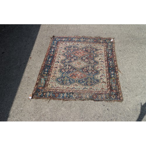 632 - A Qashqai type rug with three medallions on a bird and flower figured white ground