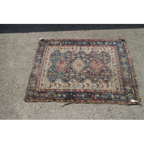 632 - A Qashqai type rug with three medallions on a bird and flower figured white ground