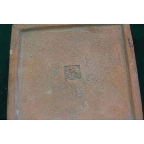 61 - A Chinese terracotta square-shaped box and cover with character decoration and seal mark to base, 3 ... 