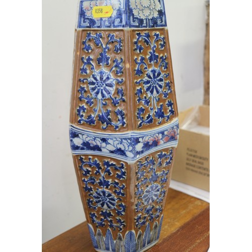 66 - A Chinese blue and white relief decorated hexagonal vase with cafe-au-lait ground, 13 1/2