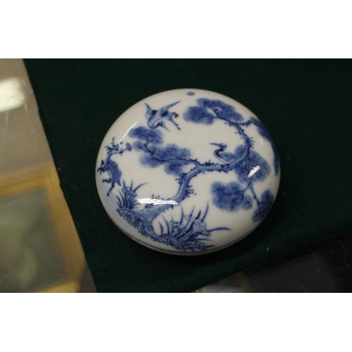 60 - A Chinese blue and white dish with dragon and cloud decoration, seal mark to base, 4” dia, a blue an... 