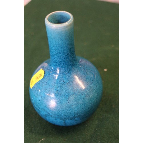 59 - A Chinese turquoise glazed squat vase with six-character mark to base, 3 3/4” high, on carved hardwo... 