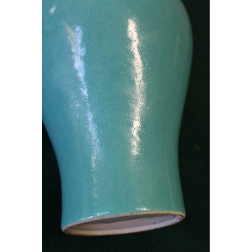 56 - A Chinese meiping turquoise glazed vase, 6 3/4” high, on turned hardwood stand