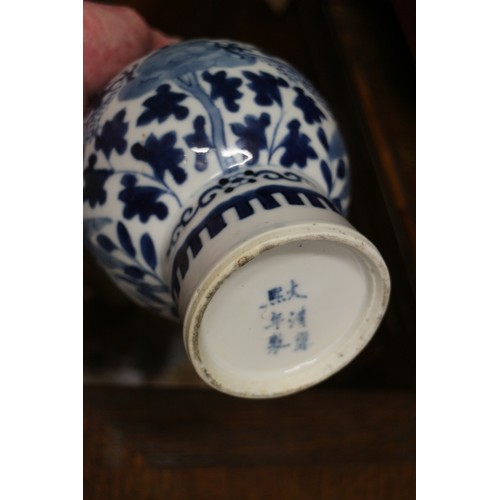 47 - A Chinese blue and white bulbous bottle neck vase with dragon, flower and tree decoration, and six-c... 