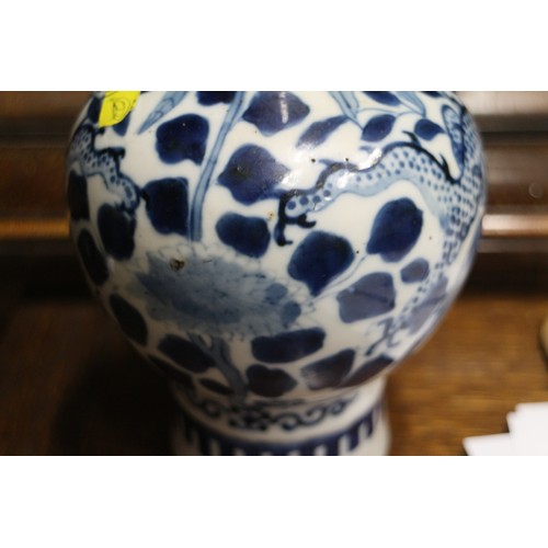 47 - A Chinese blue and white bulbous bottle neck vase with dragon, flower and tree decoration, and six-c... 