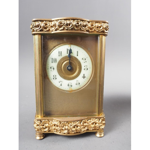 101 - A gilt brass shaped cased carriage clock, 5