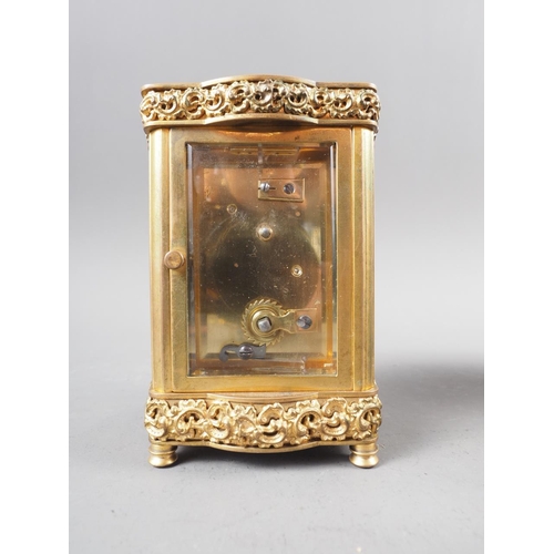 101 - A gilt brass shaped cased carriage clock, 5