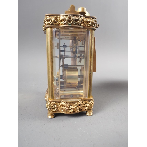 101 - A gilt brass shaped cased carriage clock, 5