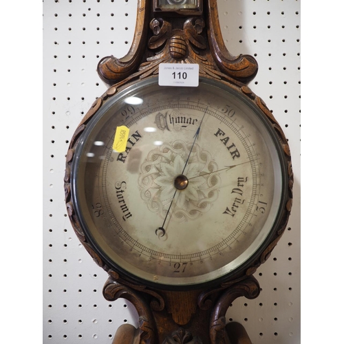 110 - A carved oak barometer and thermometer, 33 1/4