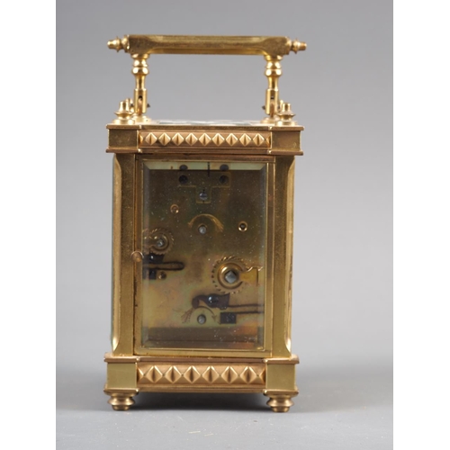 113 - A gilt brass cased carriage clock with pierced and engraved dial and eight-day alarm movement, 6