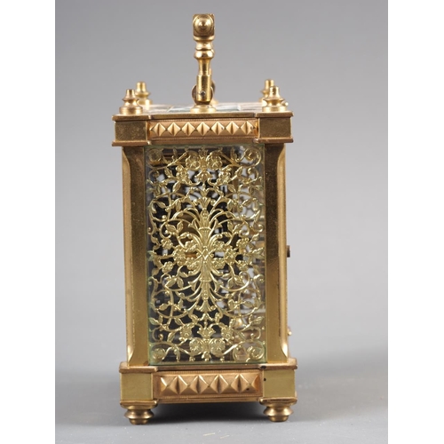 113 - A gilt brass cased carriage clock with pierced and engraved dial and eight-day alarm movement, 6