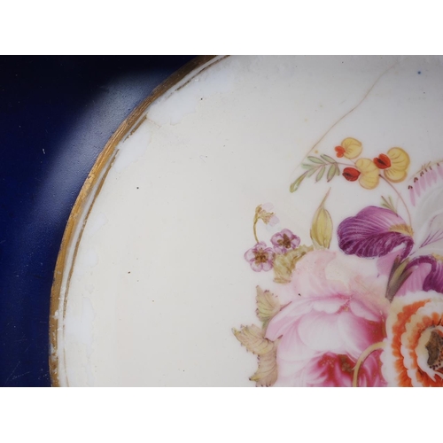 23 - A Coalport style dessert service with floral decoration on a blue and gilt ground