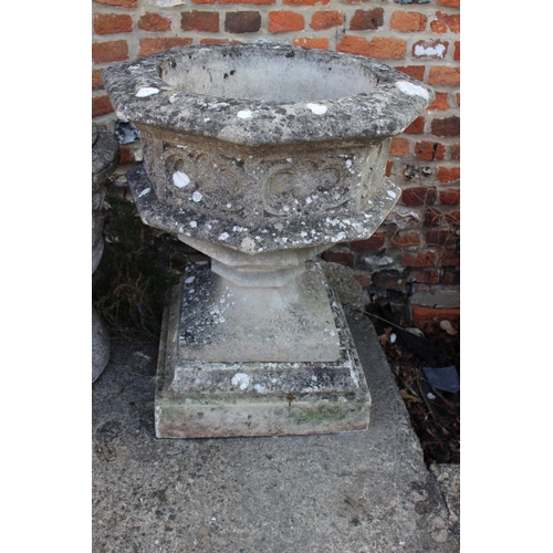 690 - A cast stone Gothic design octagonal planter, on square base, 30