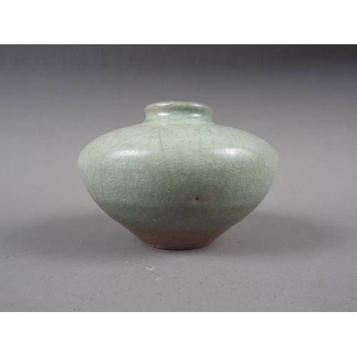 71 - Two Chinese celadon brush pots, a celadon glazed squat vase and a celadon glazed incense stand