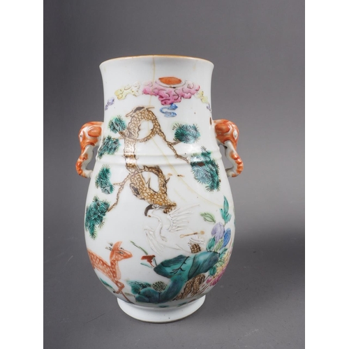 74 - A Chinese porcelain baluster vase, decorated four figures in a landscape, 9 1/2